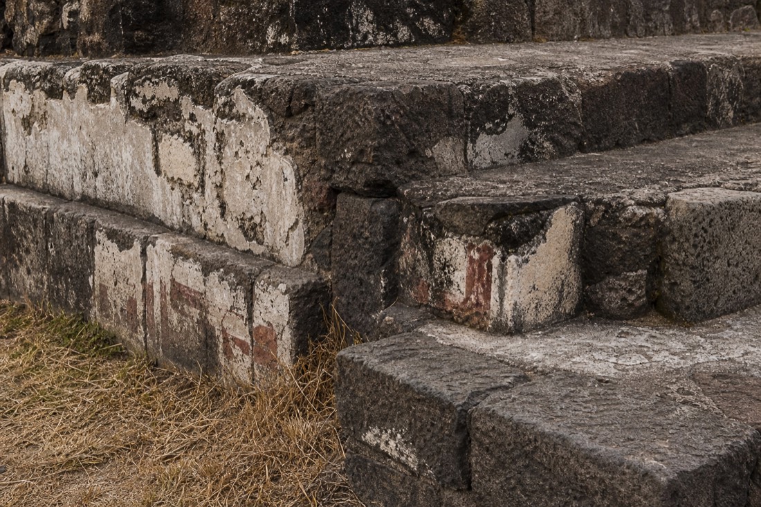 Weathered stone and surviving plaster on a ruined platform at Teotihuacan