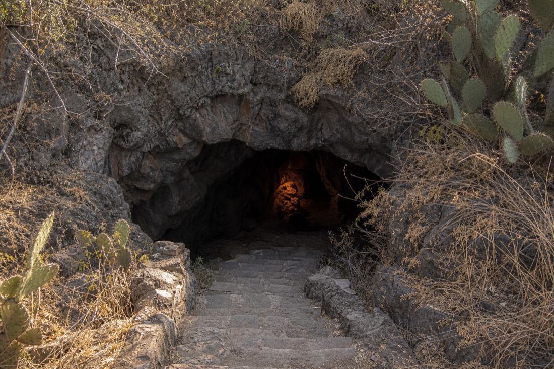 The stone stairway leading down into the lava cave restaurant beside Teotihuacan