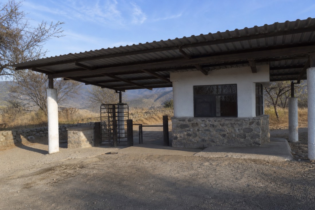 A simple archaeological site entrance gate in early morning light